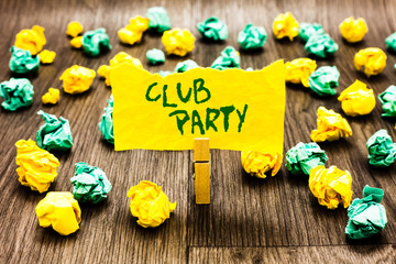 Fototapeta premium Writing note showing Club Party. Business photo showcasing social gathering in a place that is informal and can have drinks Clothespin holding yellow note paper crumpled papers several tries