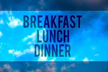 Handwriting text Breakfast Lunch Dinner. Concept meaning eating your meals at different period of day Multiline text desktop natural blue sky cloudy background send messages