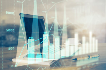 Forex Chart hologram on table with computer background. Multi exposure. Concept of financial...