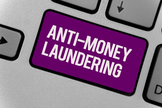 Text sign showing Anti Money Laundering. Conceptual photo stop generating income through illegal actions Keyboard key office typing class work click assign button computer program