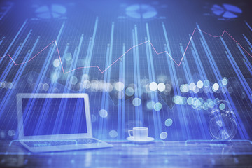 Double exposure of chart and financial info and work space with computer background. Concept of...
