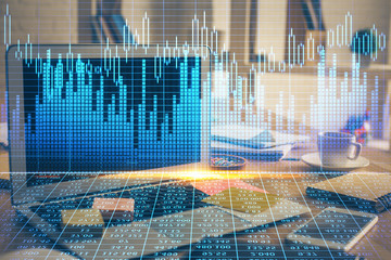 Multi exposure of chart and financial info and work space with computer background. Concept of...