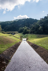 Long concrete spillway with the water flow.