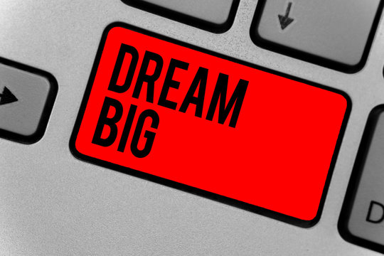 Text sign showing Dream Big. Conceptual photo To think of something high value that you want to achieve Keyboard red key Intention create computer computing reflection document