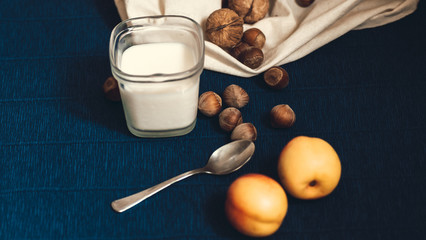 homemade greek yoghurt with walnut and  hazelnut nuts and peach