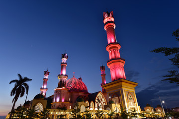 Illuminated minarets of the biggest mosque in Lombok, Islamic Center in Lombok Island, Indonesia