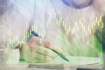 Forex chart displayed on woman's hand taking notes background. Concept of research. Multi exposure