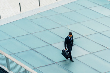 Young Indian Businessman Walking Inside the Offices Building. Vi