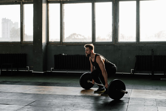 Man with barbell working out