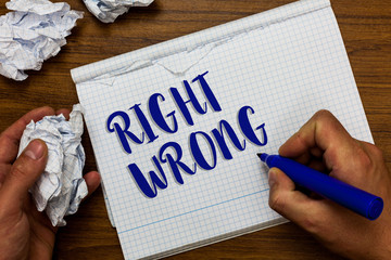 Conceptual hand writing showing Right Wrong. Business photo showcasing choose between two decisions correct and bad one to make Man holding marker notebook crumpled papers ripped pages