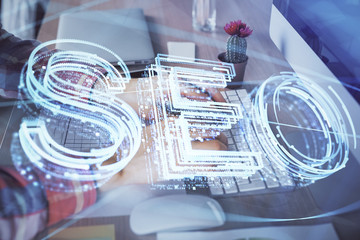 Double exposure of seo icon with man working on computer on background. Concept of search engine optimization.