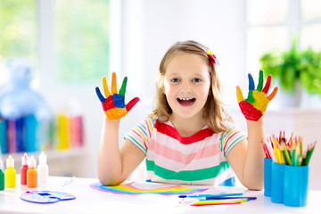 Kids paint. Child painting. Little girl drawing.