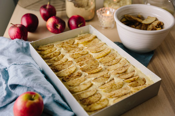 Sugar and spice coated apple slices on top of traybake cake