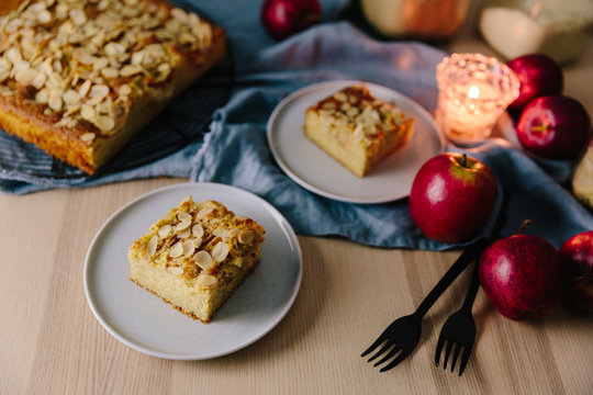 Apple and Almond cake slice on textured plate