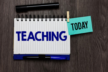 Conceptual hand writing showing Teaching. Business photo text Act of giving information, explaining one subject to a person Ideas notebook wooden table markers for today important reminder