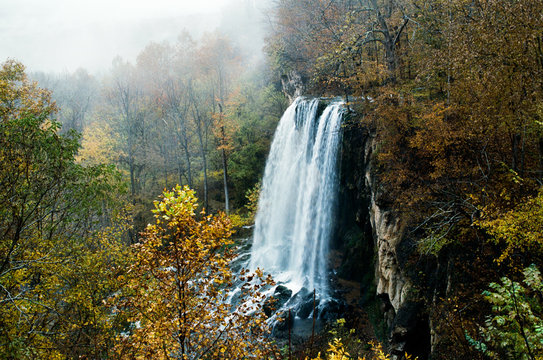 waterfall in autumn leaves