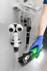 Professional equipment of a veterinary doctor ophthalmologist - manual slit lamp, ophthalmoscope,...