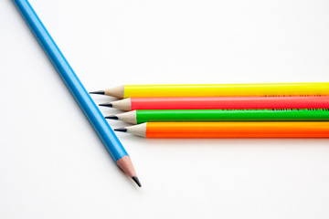 colored pencils in the shape of a star on a white background