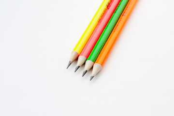 colored pencils in the shape of a star on a white background