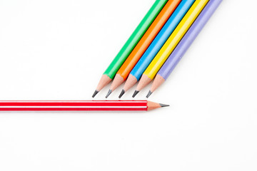 colored pencils in the shape of a star on a white background