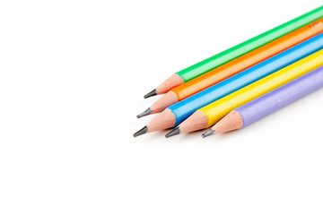 colored pencils in the shape of a star on a white background