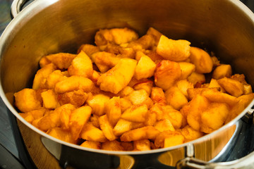 Pieces of peach fruit in cooking pot