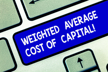 Conceptual hand writing showing Weighted Average Cost Of Capital. Business photo showcasing Wacc financial business indicators Keyboard key Intention to create computer message idea