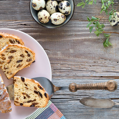 Easter Bread (Osterbrot in German). Top view of traditional fruty bread on rustic wood with fresh...
