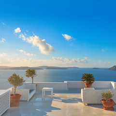 Fototapeta na wymiar A view of beautiful sea and caldera with luxury roof terrace