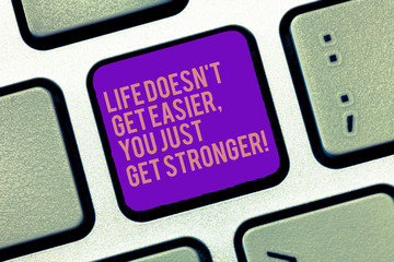 Word writing text Life Doesn T Get Easier You Just Get Stronger. Business concept for Inspiration to keep going Keyboard key Intention to create computer message, pressing keypad idea