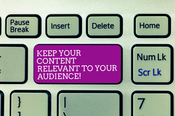 Conceptual hand writing showing Keep Your Content Relevant To Your Audience. Business photo text Good marketing strategies Keyboard Intention to create computer message keypad idea