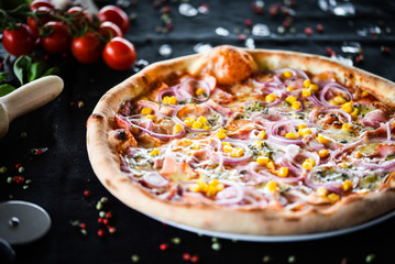 fresh italian pizza with tuna, red onion & corn