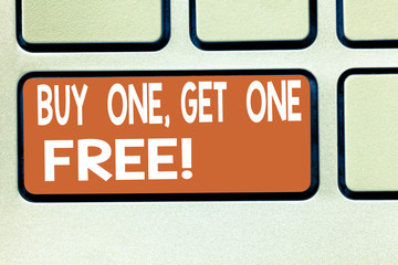 Text sign showing Buy One Get One Free. Conceptual photo Promotion discount special offering in gift card Keyboard key Intention to create computer message pressing keypad idea