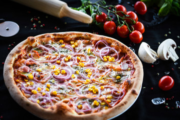 fresh italian pizza with tuna, red onion & corn