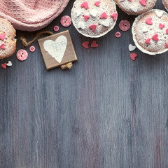 Sugar-sprinkled muffins with pink and white fondant icing hearts