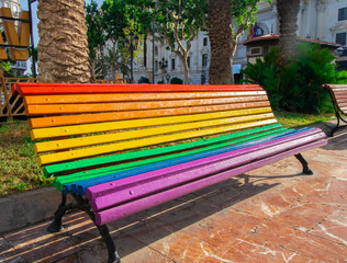 Bench painted in the color of the rainbow. The symbol of the LGBT community.