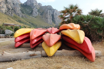 Colorful kayaks on beach