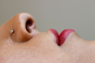 Fototapeta premium Red lipstick plowed lip, Picture
