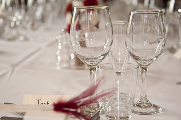 Formal table laid out for a wedding with white table cloth