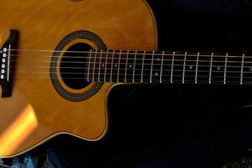 Fototapeta na wymiar Acoustic guitar nickel strings background