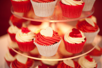Red cupcakes on a glass stand stock photo
