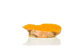 One slice of bright turmeric rhizome orange flesh isolated on white background