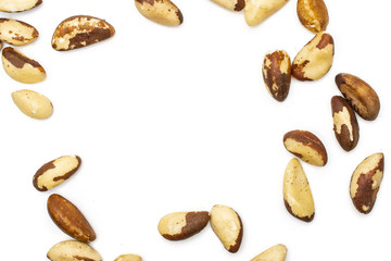 Lot of whole unshelled brazil nut copyspace in middle flatlay isolated on white background