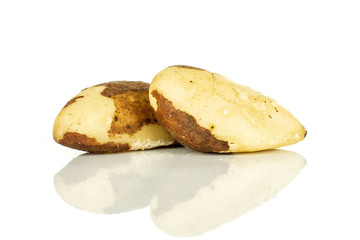 Group of two whole unshelled brazil nut isolated on white background