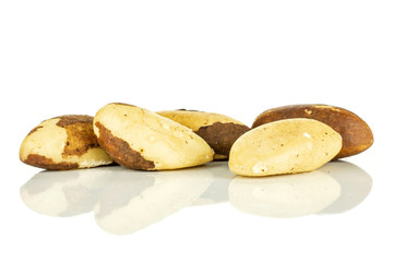 Fototapeta na wymiar Group of five whole unshelled brazil nut isolated on white background