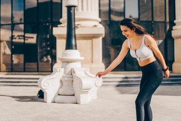 Young woman on roller skates outdoors in down town