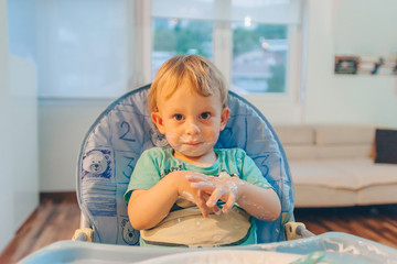 Innocent baby eating food