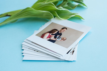 printed photos of baby. Orenburg Russia 17.06.19. photography cards, background with a white flower. Mock up