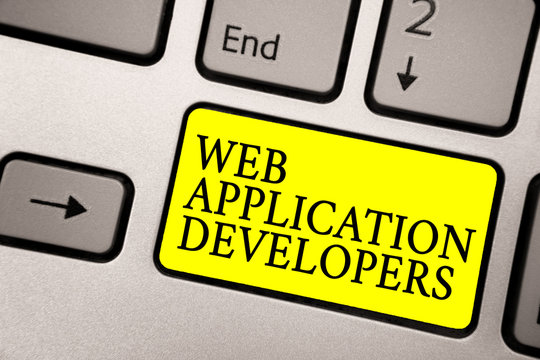 Word writing text Web Application Developers. Business concept for Internet programming experts Technology software Grey silvery keyboard with bright yellow color button black color texts