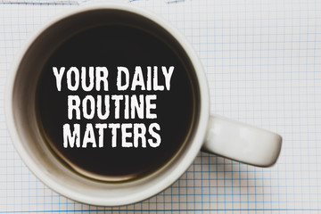 Writing note showing Your Daily Routine Matters.. Business photo showcasing Have good habits to live a healthy life Coffee mug with black coffee floating some white texts on white paper